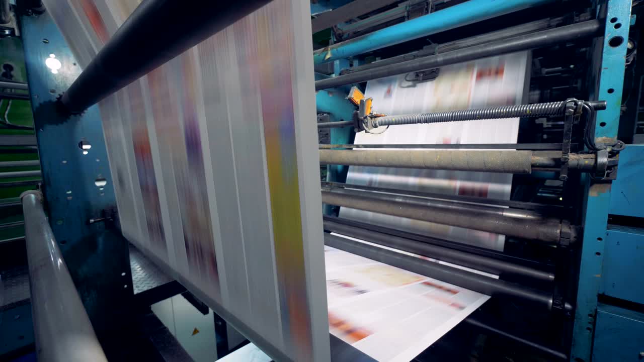 Production of broadsheet newspaper in a printing factory.