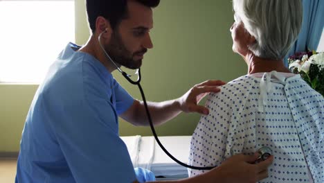 nurse checking the patient with stethoscope