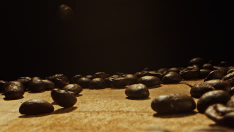 coffee-beans-falling-from-above-on-a-wooden-surface