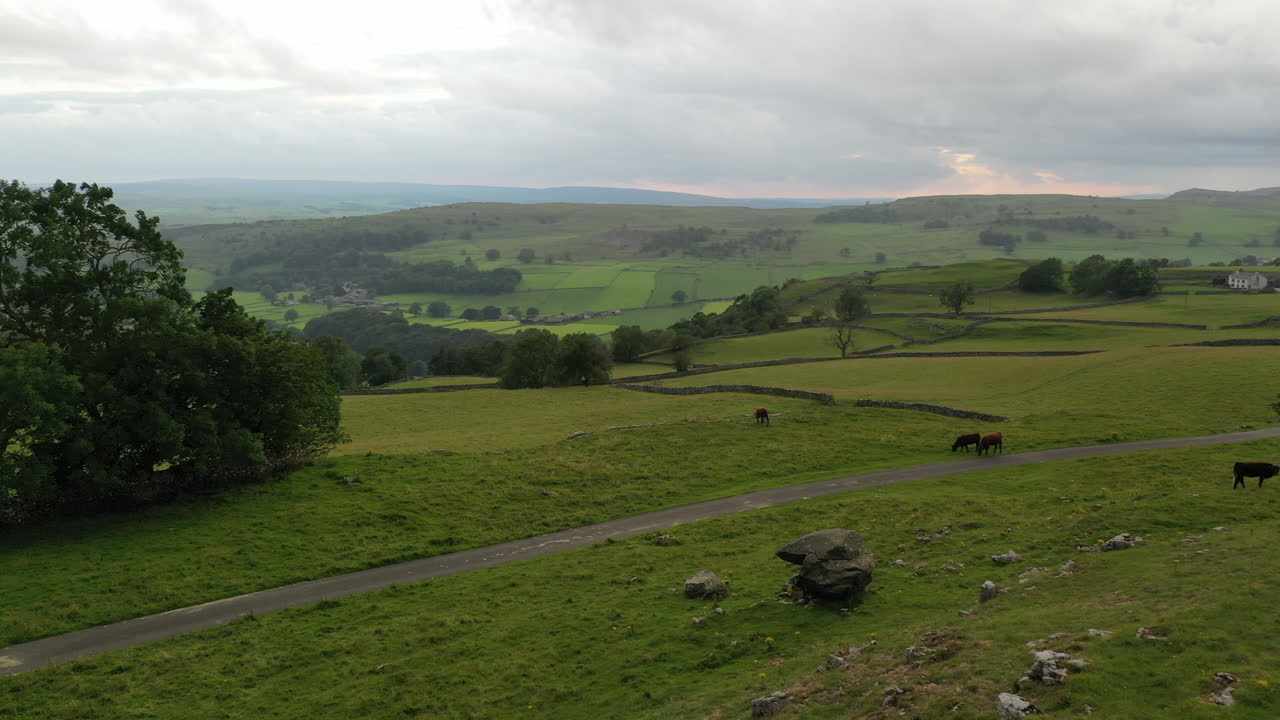 Drone flight turning left and rising over the yorkshire dales at sunset with rain in the distance part 2