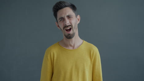 man expressing sadness and frustration