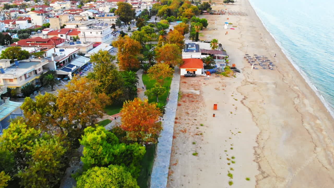 Panorama of the Asprovalta with multiple buildings and greenery. Aegean sea coast. Sunny day. Greece