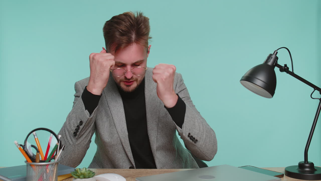 Sad business man nervous breakdown loses becoming surprised by lottery results bad unlucky fortune