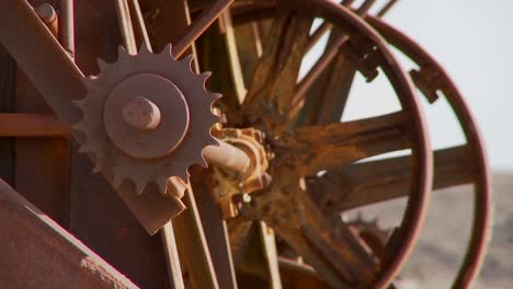 old cogwheels rust in the sun at an abandoned mine 1