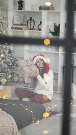 girl opening christmas gift