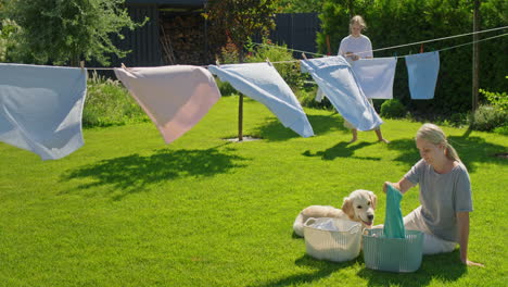 family doing laundry outdoors