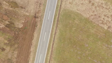 above the road where cars driving, zoom in, drone 4k