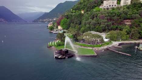 aerial toward the famous lake como water fountain villa geno, italy