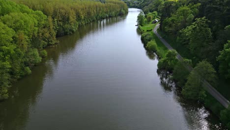 Mayenne-River-crossing-french-countryside-at-low-altitude,-France