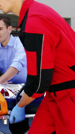 paramedics rushing a patient in emergency