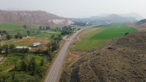 Aerial-Views-Over-Cariboo-Highway-near-Desert-Hills-Ranch-Farm-Market-and-Cache-Creek-in-British-Columbia,-Canada