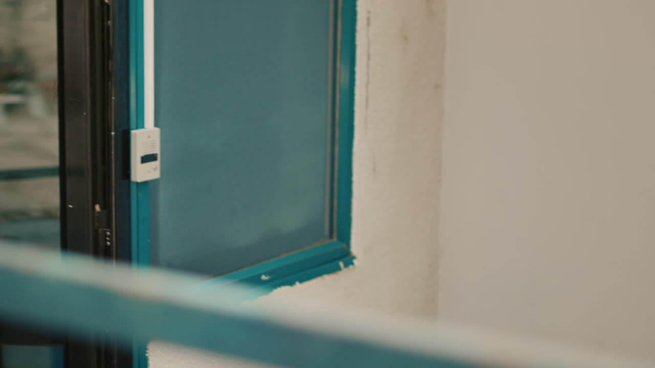Images of a person and boxes near a door