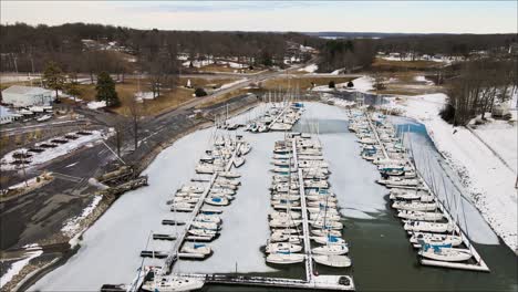 flyover of frozen marina at lighthouse landing in grand rivers, kentucky