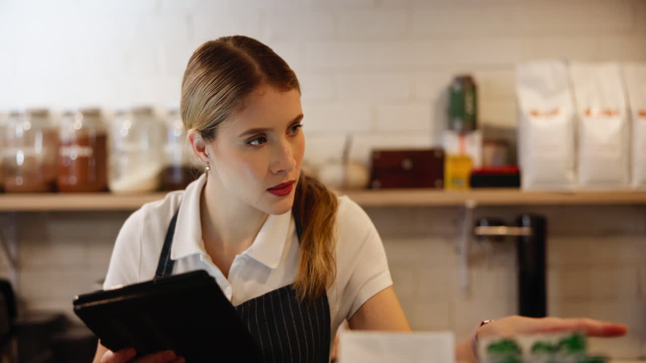 Waitress taking orders in a coffee shop