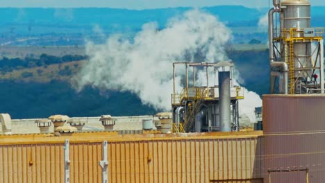 air pollutants in the steam from a factory smokestack - slow motion