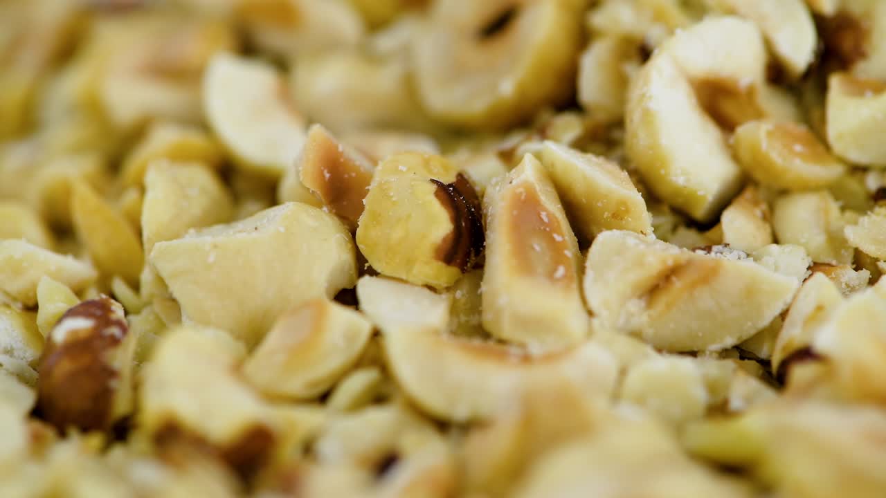 Chopped Hazelnuts on a rotating plate (seamless loopable)