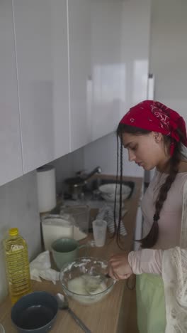 young woman baking in kitchen