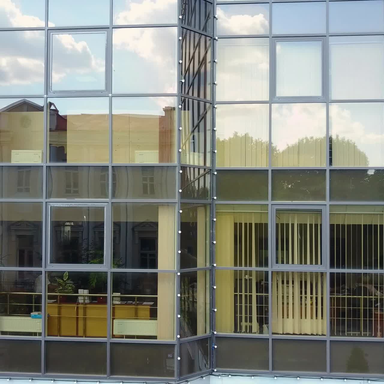 Modern Architecture Facade, Business Concept. Aerial shot of the windows at office skyscraper building