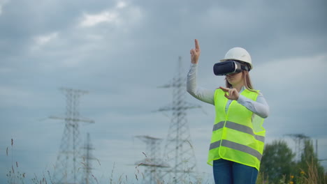 a female engineer manages the transmission of alternative energy from solar panels and wind farms to the consumers of the metropolis. the concept of the modern city