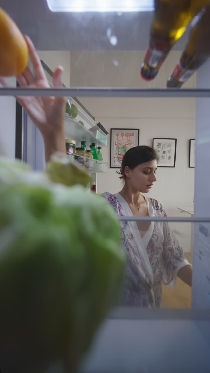 Woman inside refrigerator
