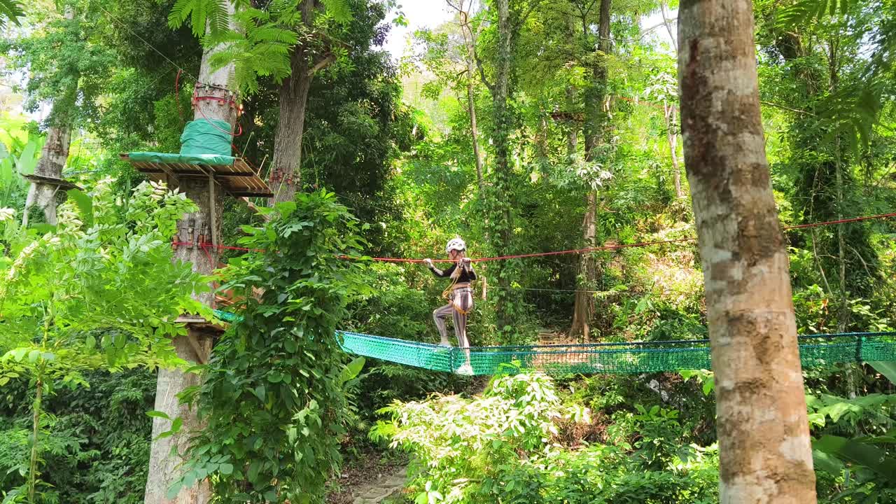 Woman enjoying a scenic adventure park zip-line experience