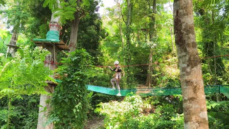 woman enjoying a scenic adventure park zip-line experience