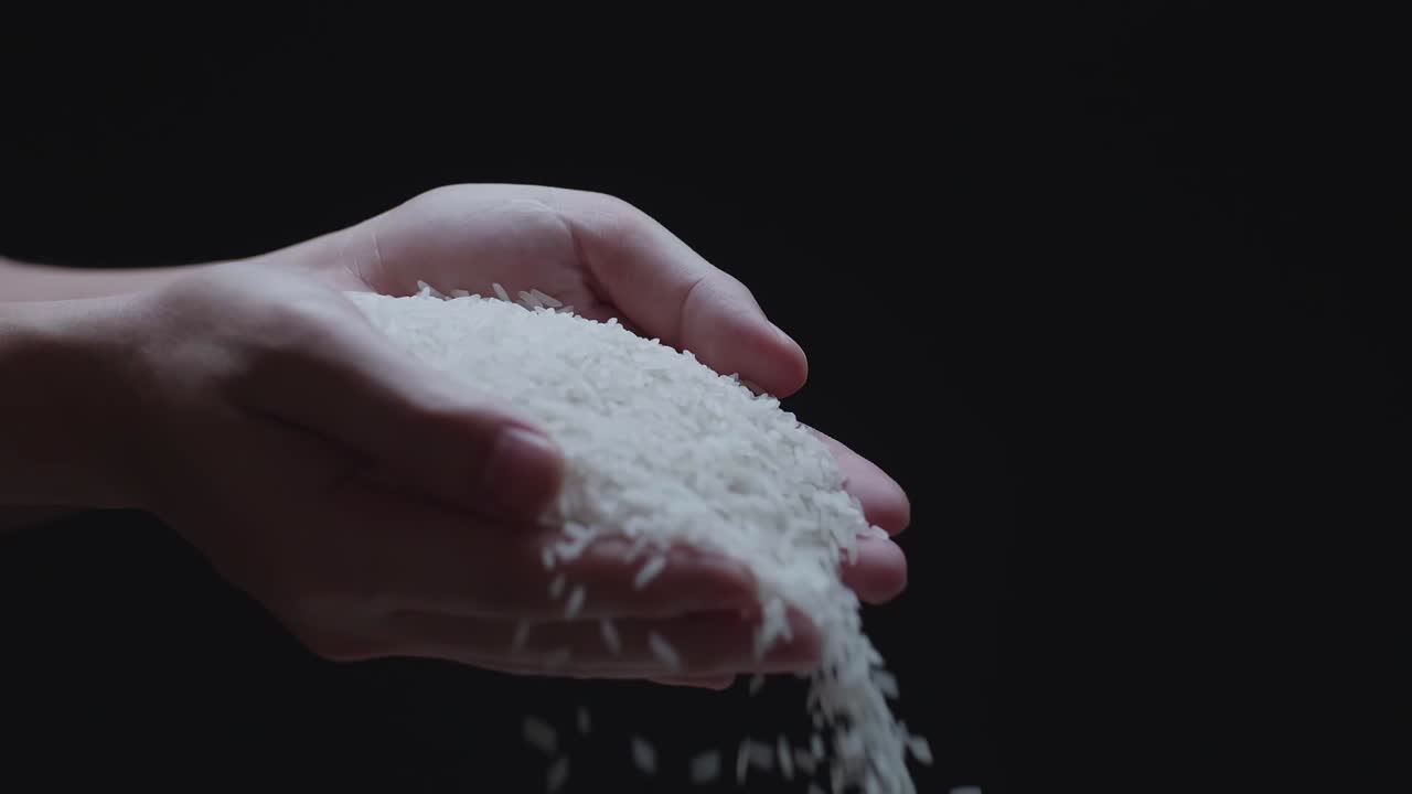Used Their Hands Pouring White Rice In A Slow Motion
