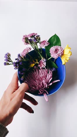 flowers in a blue bowl