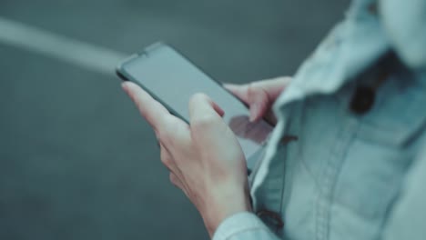 Person-is-walking-and-using-a-smartphone-at-the-same-time