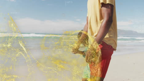 walking on beach, man in yellow shirt surrounded by animation of sparkles