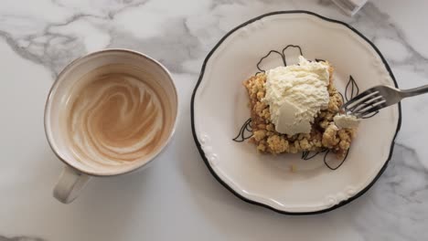 Eating-Apple-Pie-with-Ice-cream-on-top-and-drinking-Coffee-with-milk