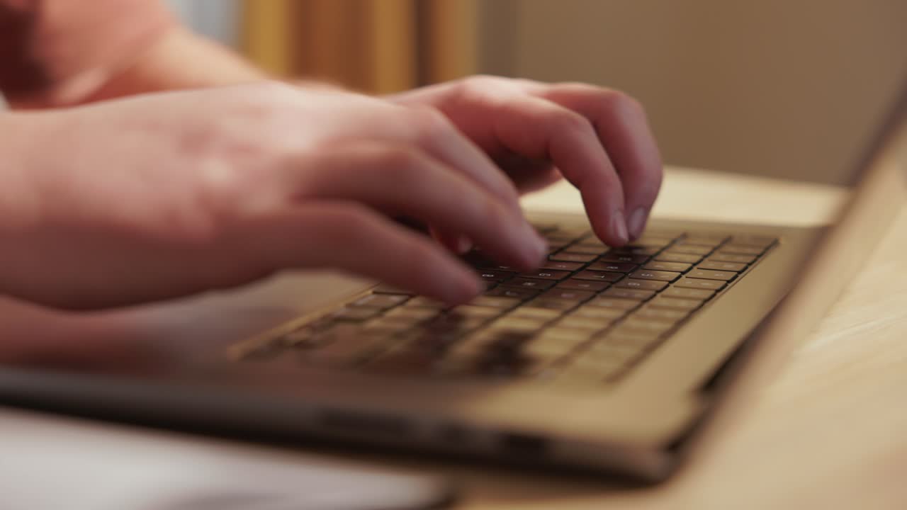 Close Up Of Hands Typing On Laptop Computer