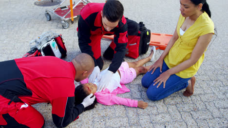 mother cries for her injured daughter on street