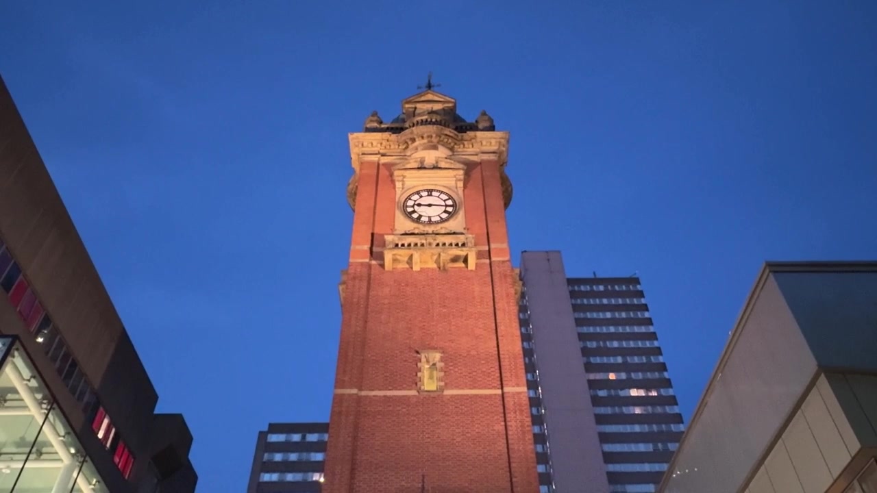 View of the Victoria Centre Clock Tower on Milton Street in Nottingham city centre, featuring a well-known urban landmark and shopping district setting.