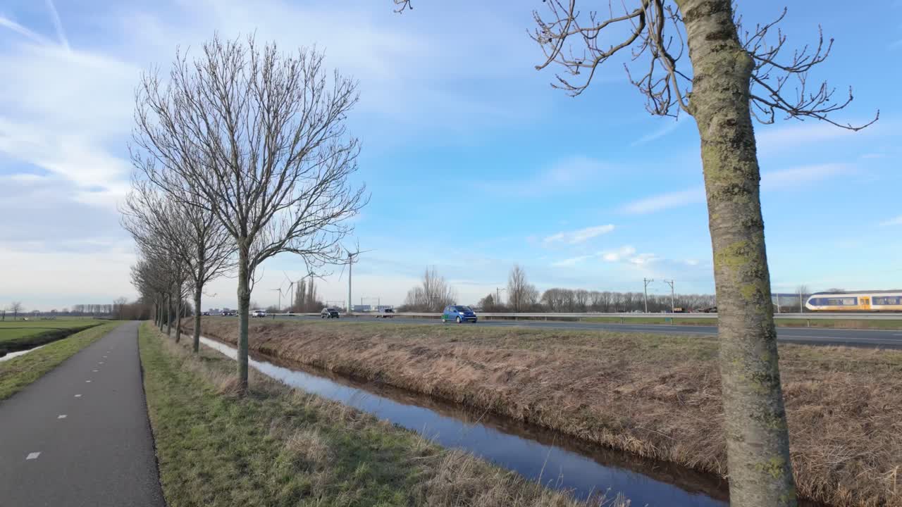 Bicycle Lane And Dikes Near Road Traffic In Netherlands