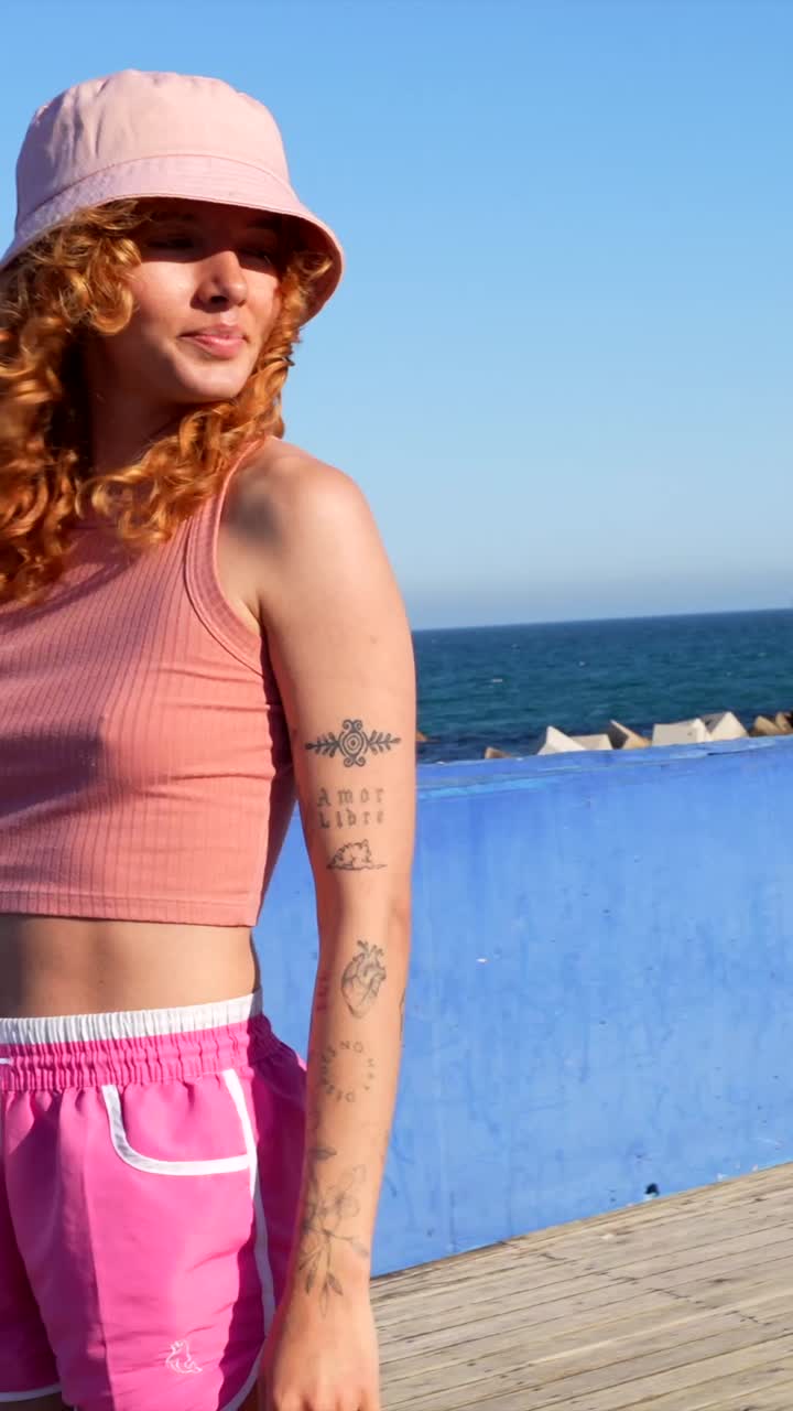 People on the beach with tattoos