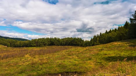 timelapse with movement of clouds moiving in over field in norway on a beautiful and sunny day