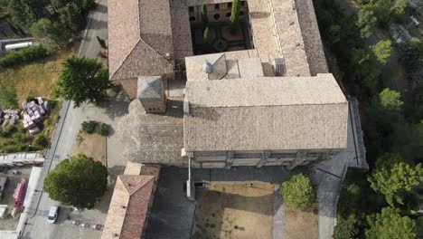 Top-down-rising-reveal-over-Leyre-Monastery-in-Navarra,-sunny-and-warm