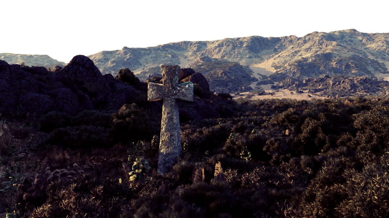 Ancient stone cross standing amid rugged terrain with distant mountains