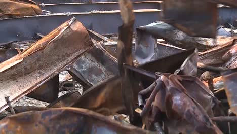 cleaning up a burnt building using an excavator