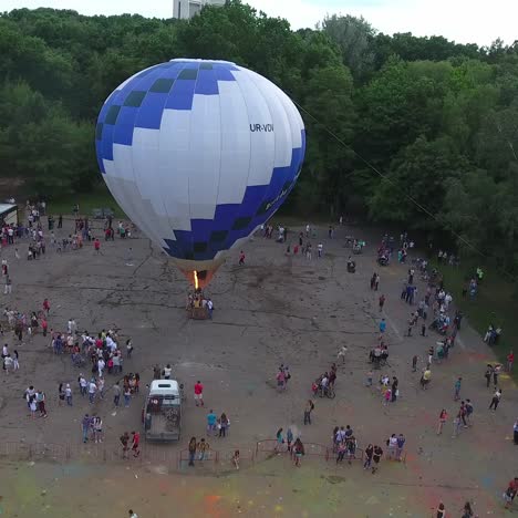 air balloon is getting ready to take off. vinnitsa, ukraine - july 2017: aerial shot of the hot air balloon is getting ready to take off in city park