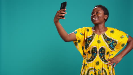 Female-model-being-excited-and-happy-on-her-pictures-in-studio