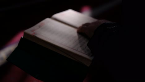 Hands-Holding-Quran-In-Sunlight