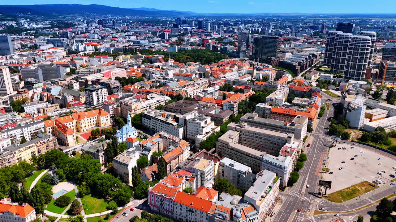 Combination of old style and new style architecture in the modern city. Drone footage over the cityscape of Bratislava, Slovakia