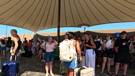 tourists assembling under a canopy in sorrento