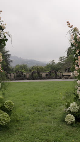 scenic garden view framed by floral arrangements