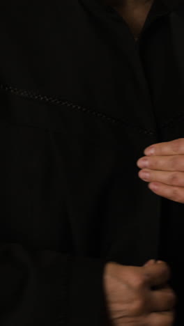 woman in a black robe