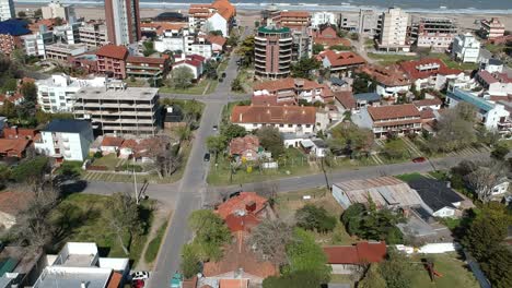 aerial footage from the city with the ocean in the background