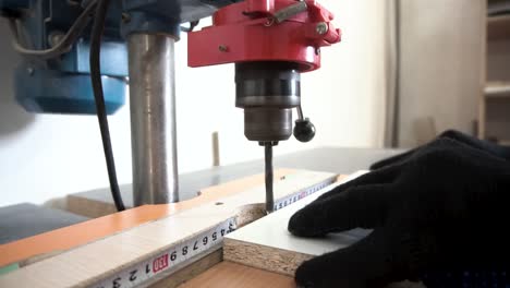 drilling a hole in wood with a drill press