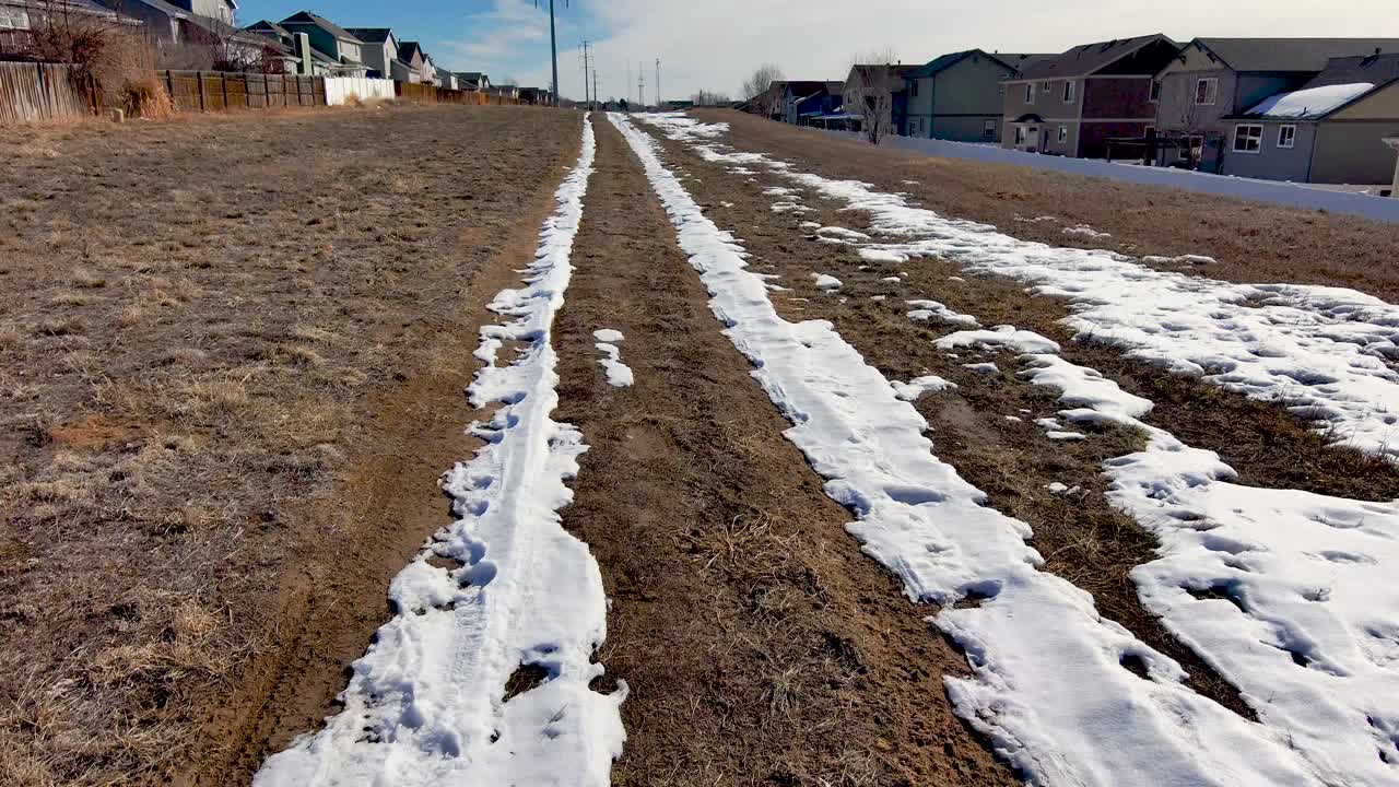 High-Voltage Utility access road covered in winter snow.